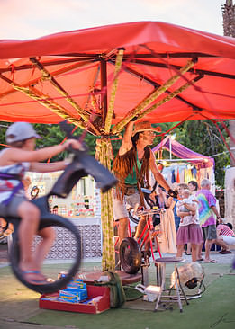 Manual ride in the hippie night market of Las Dalias, Ibiza, Spain